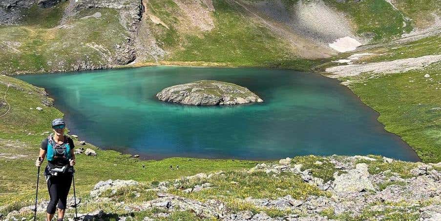 Angela Shartel by an alpine lake in Silverton, Colorado.
