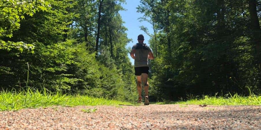 Joe Dean running on a trail. 