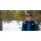 Courtney Dauwalter smiling outside in the snow wearing Injinji x Knockaround Sunglasses.