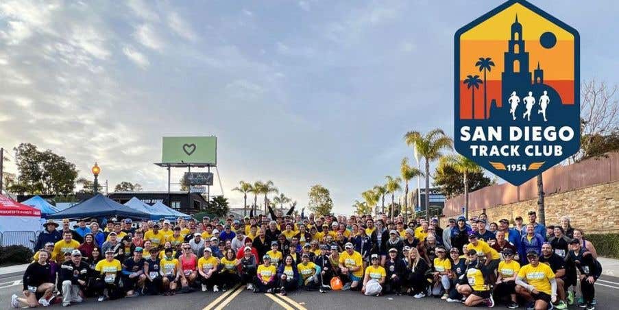 An outdoor group photo of the San Diego Track Club. 