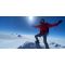 Meghan Buchanan wearing full ice mountaineering gear at the top of one of the Seven Summits.