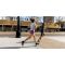 Two runners mid-stride on a wide city sidewalk.