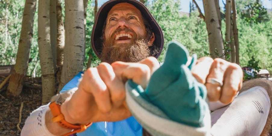 MIke Wardian putting on Injinji Trail Midweight Mini-Crew socks.