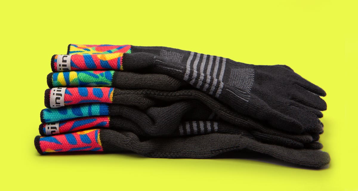 A pile of unisex and women's Spectrum Trail Midweight Mini-Crew socks 