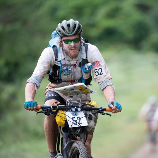 Travis Macy riding a bike during the endurance race competition