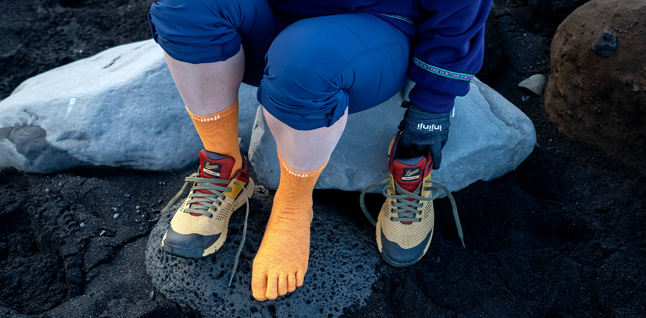 Orange Injinji Liner with a hiking boot