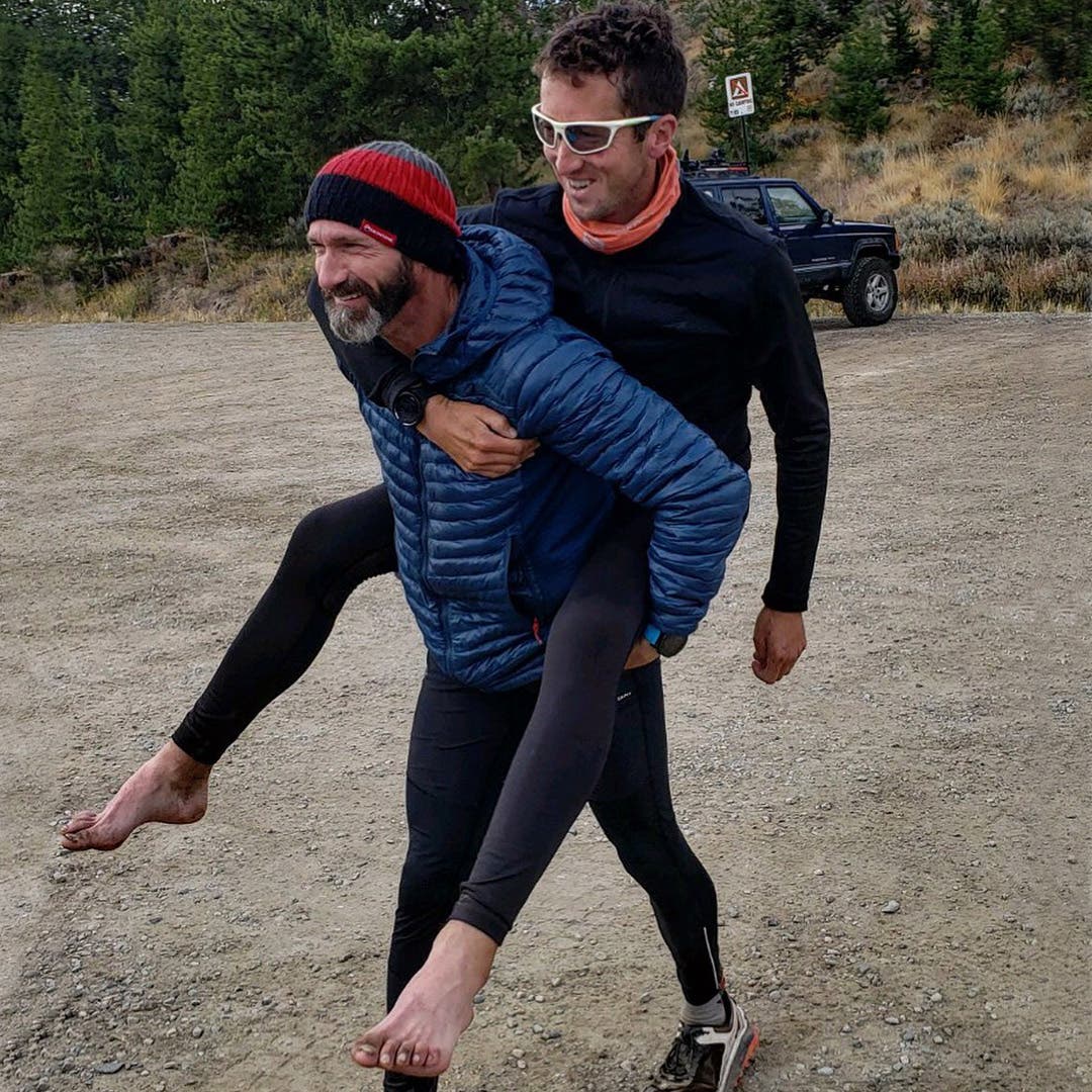 Ben Light carrying a barefoot Mike McKnight on his back. Ben Light carrying a barefoot Mike McKnight on his back.