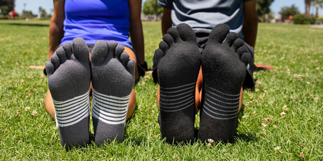 Feet of two persons wearing Injinji toesocks