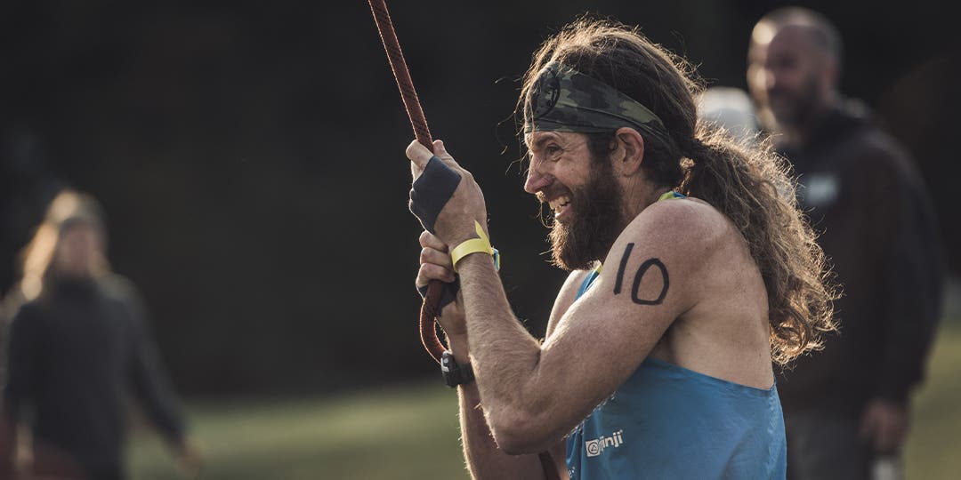 Ultra runner Mike Wardian energetically pulling the rope toward him