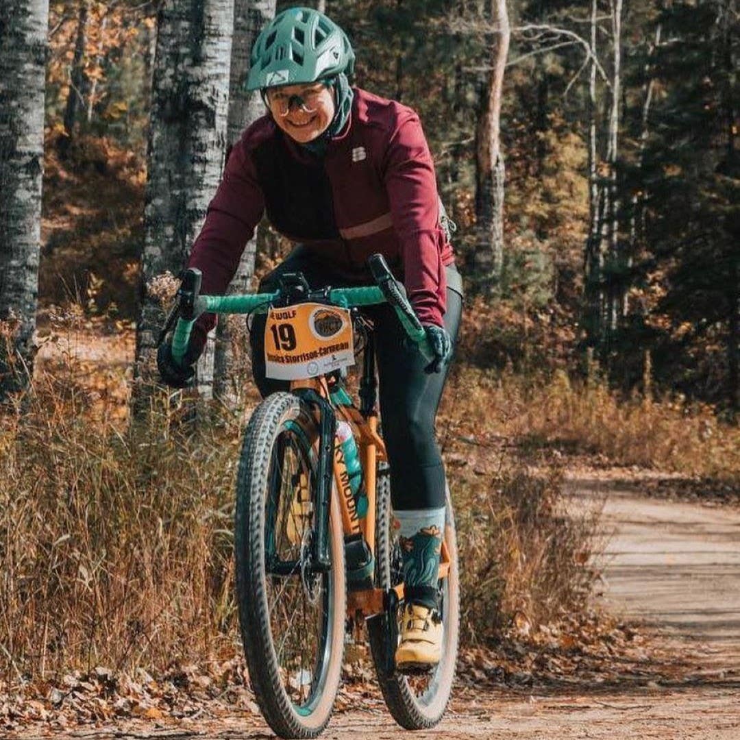 Team Injinji athlete Jessica Storrison-Carmean riding her bike in the Lone Wolf gravel race.