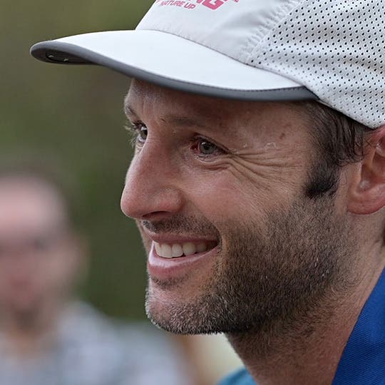 Smiling Jeffrey Stern wearing a white cap