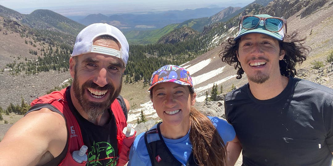 Peter Mortimer posing on Humphrey's Peak with Team Injinji athlete Jade Belzberg and her husband Nicodemus De La Rosa.