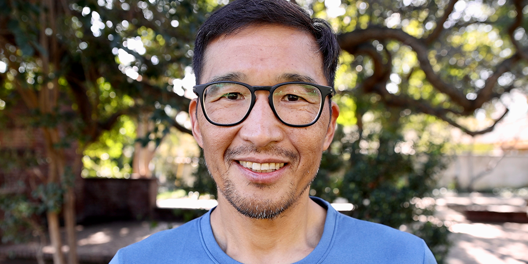 Close-up of Phil Shin's face, a Korean American athlete on Team Injinji.