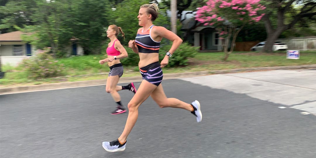 Cate Barrett running with a friend on a suburban road in the early stages of her first pregnancy.