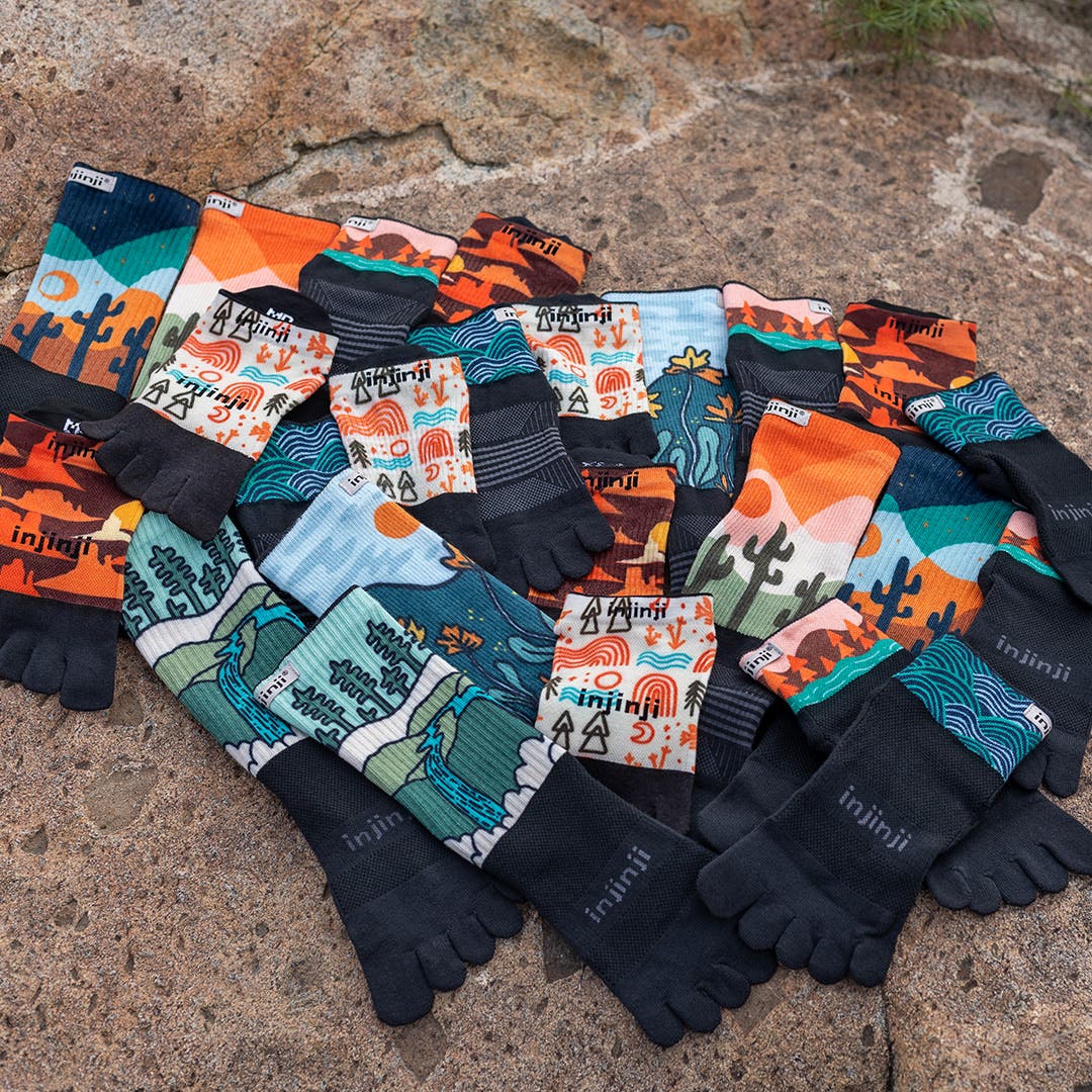 A sock pile of every Injinji Artist Designed style in The Canyons collection.