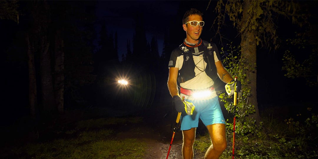 Athlete Mike McKnight with trekking poles doing a night walk 