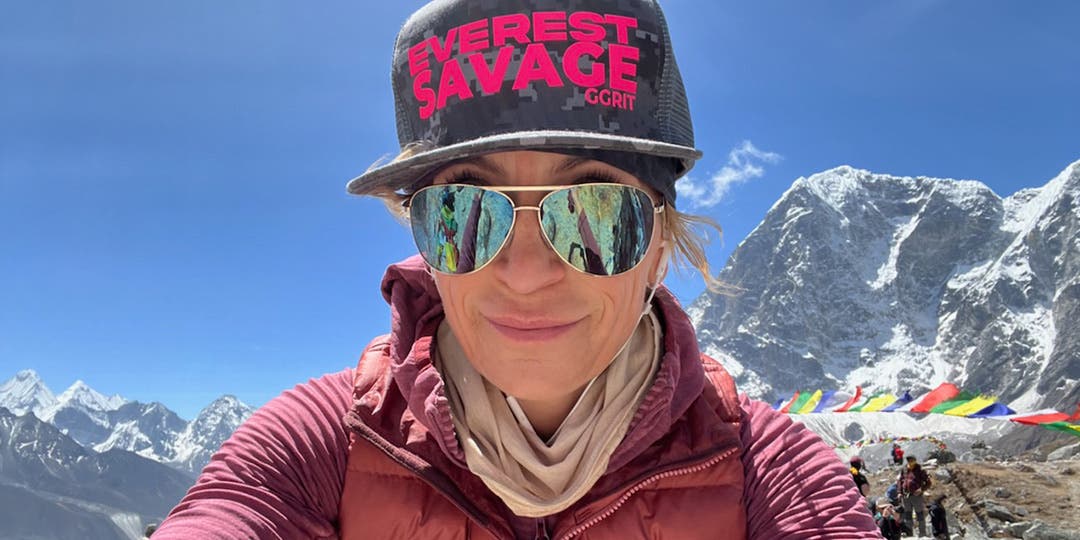 Team Injinji Athlete Meghan Buchanan dressed in pink taking a selfie at Mt Everest Basecamp.