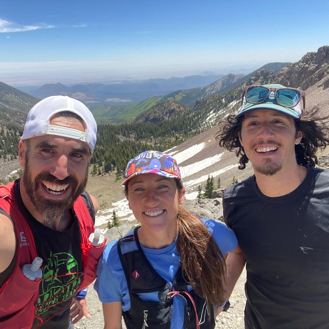 Peter Mortimer posing on Humphrey's Peak with Team Injinji athlete Jade Belzberg and her husband Nicodemus De La Rosa.
