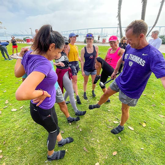 San Diego Track Club runners do an all-in using their feet while wearing Injinji toesocks. San Diego Track Club runners do an all-in using their feet while wearing Injinji toesocks.