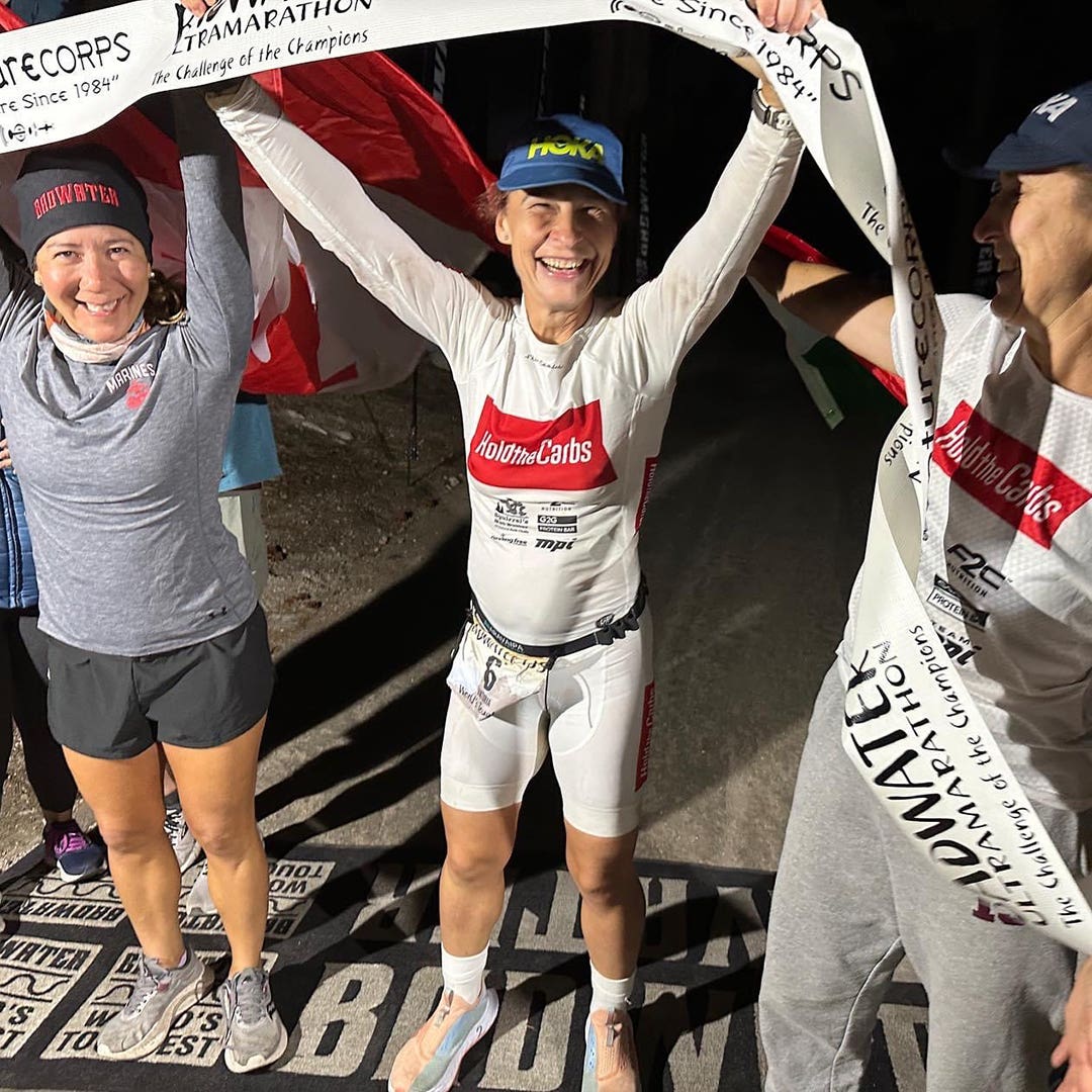 Viktoria Brown celebrating with her crew members at the finish line of the Badwater 135 ultra.