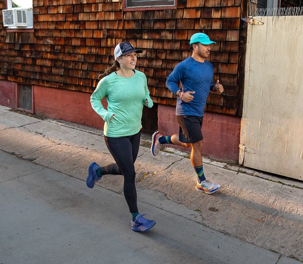 Two runners in the new Injinji Performance Shirt Collection short and long sleeve shirts.