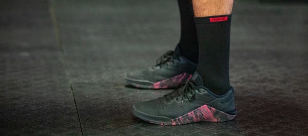 Person standing with shoes and socks on