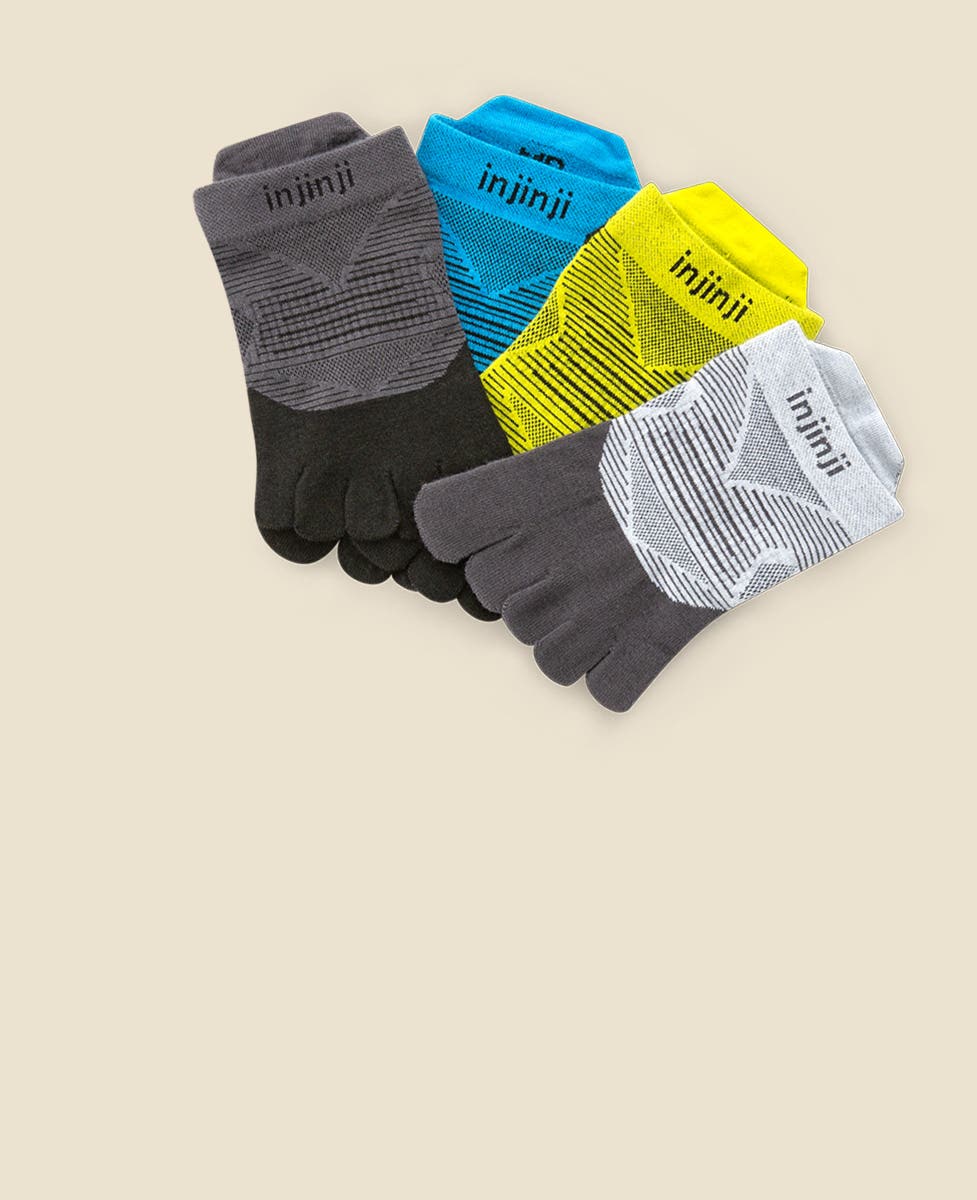 Four pairs of socks laying flat