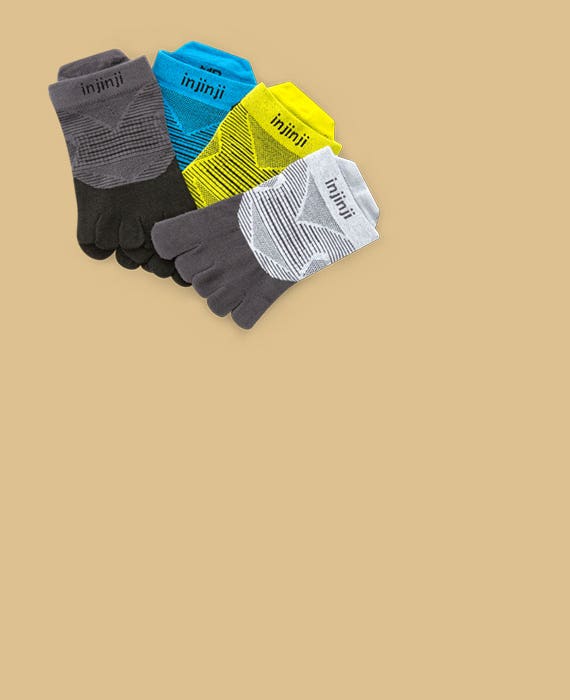 Four pairs of socks laying flat