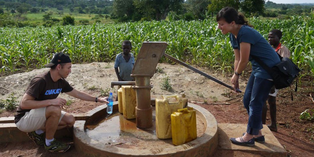 Jonathan Gunderson filling the water bottle from the well in Uganda