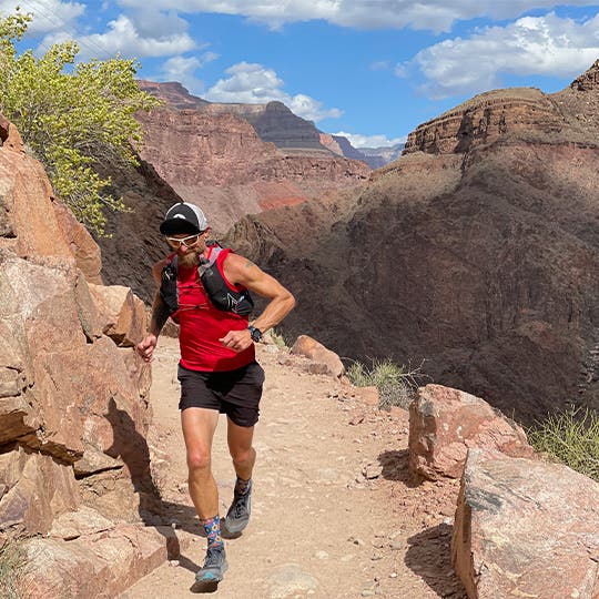 Male athlete running at the Grand Canyon North Rim. Male athlete running at the Grand Canyon North Rim.