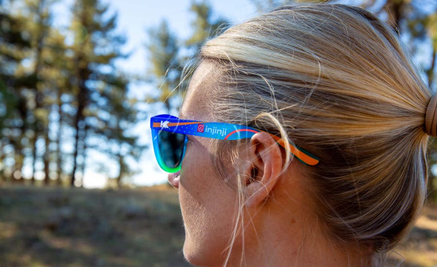 Woman wearing the New Injinji X Knockaround Premium Sport Sunglasses 