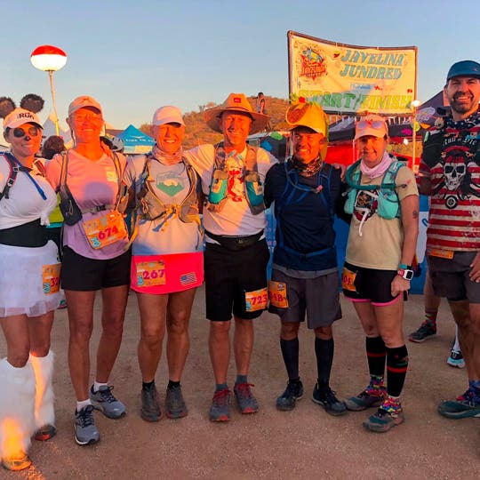 Seven participants of the "San Diego Ultra Running Friends" group standing side by side